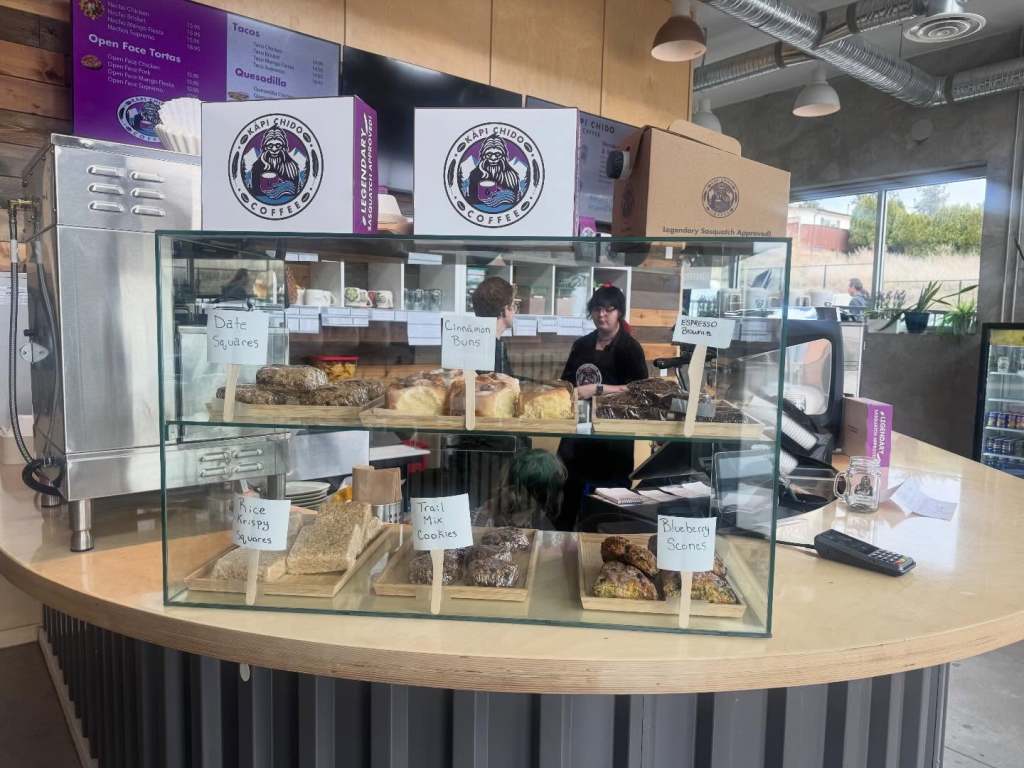 iN PHOTOS: Indigenous owned, Mexican inspired café launches in West Kelowna | iNwine Baked goods are placed under a glass cover at a cafe.