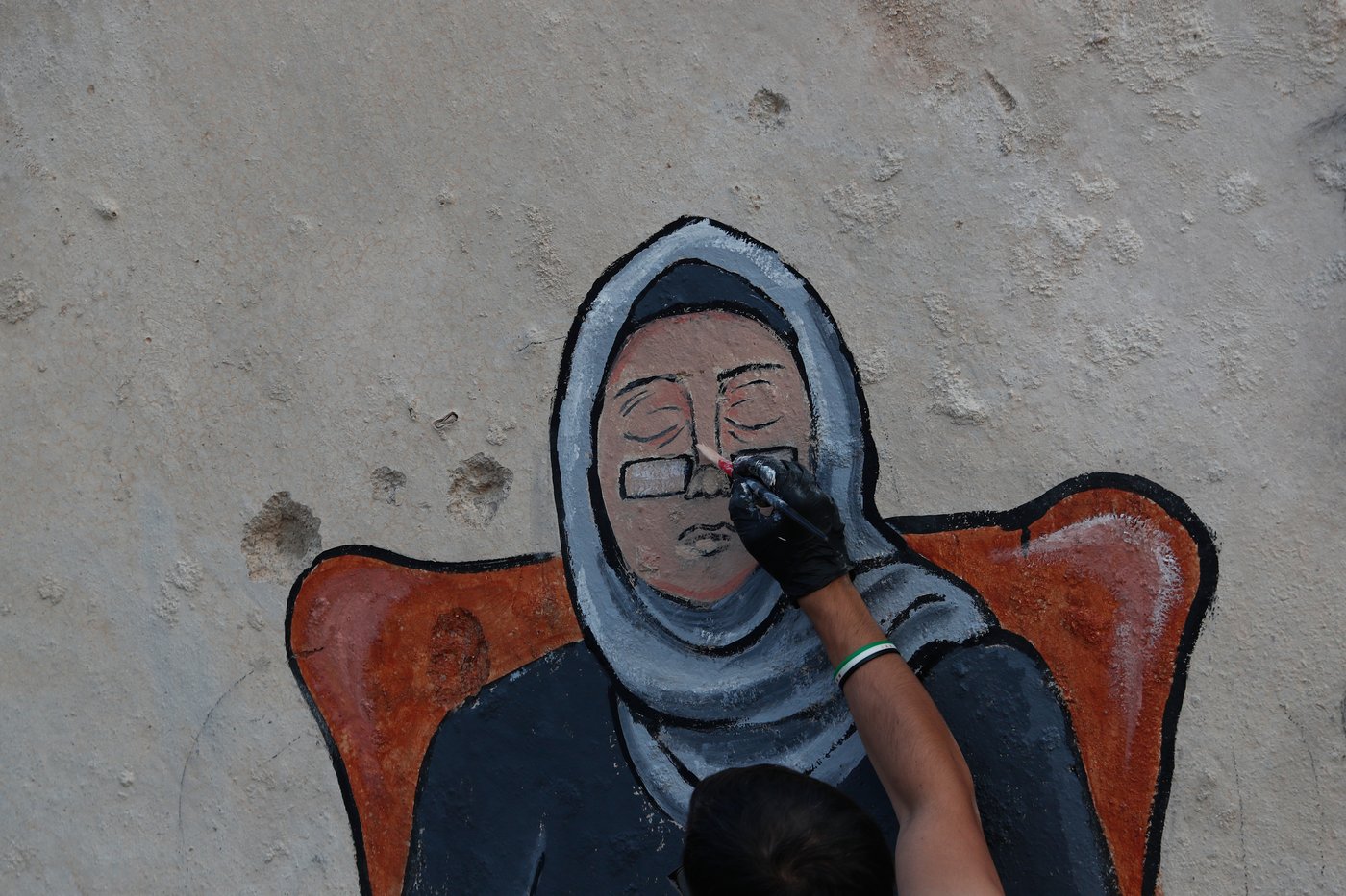 Syrian artists transform bombed-out house into a mural of remembrance, in photos | iNFOnews.ca