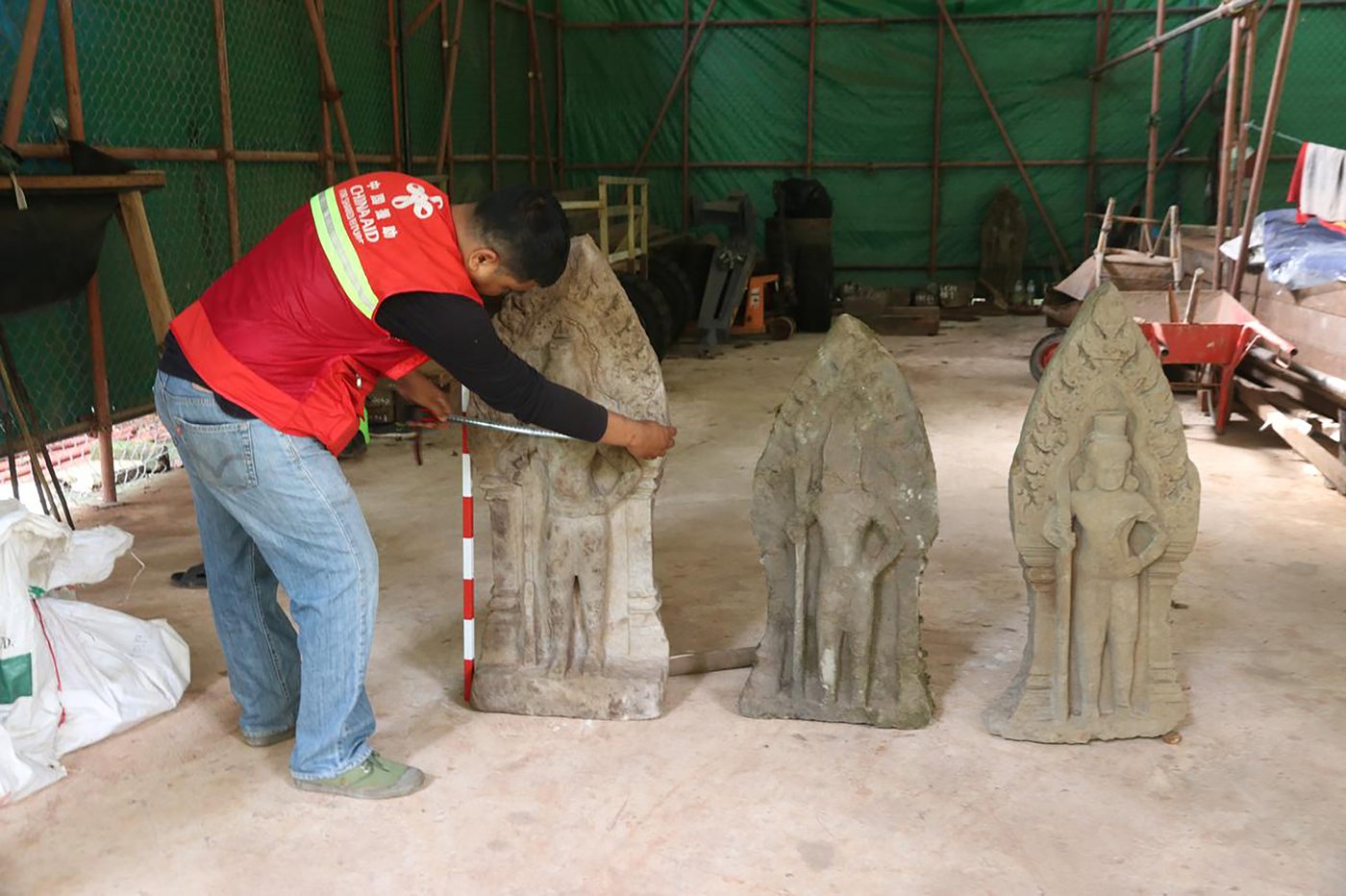 Cambodian archaeologists discover a dozen centuries-old sandstone statues at Angkor UNESCO site | iNFOnews.ca Cambodian archaeologists discover a dozen centuries-old sandstone statues at Angkor UNESCO site | iNFOnews.ca