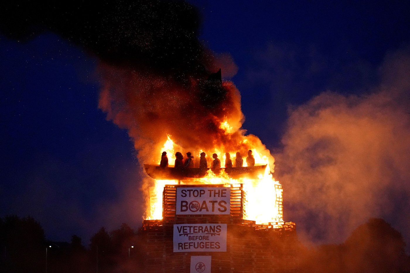 Burning of migrant boat effigy in Northern Ireland triggers police investigation | iNFOnews.ca
