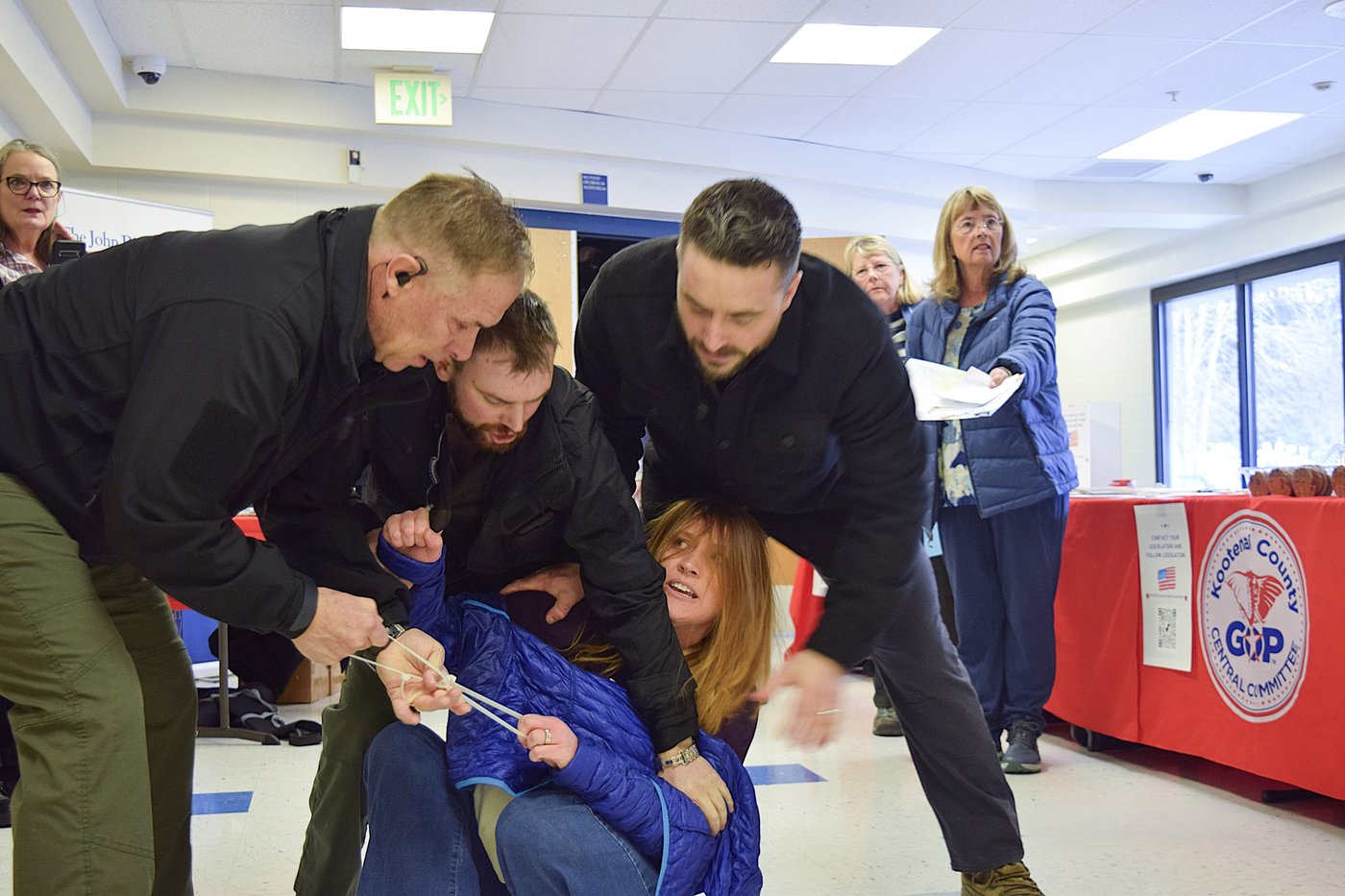 Private security guards charged after woman was dragged out of chaotic Idaho town hall meeting | iNFOnews.ca
