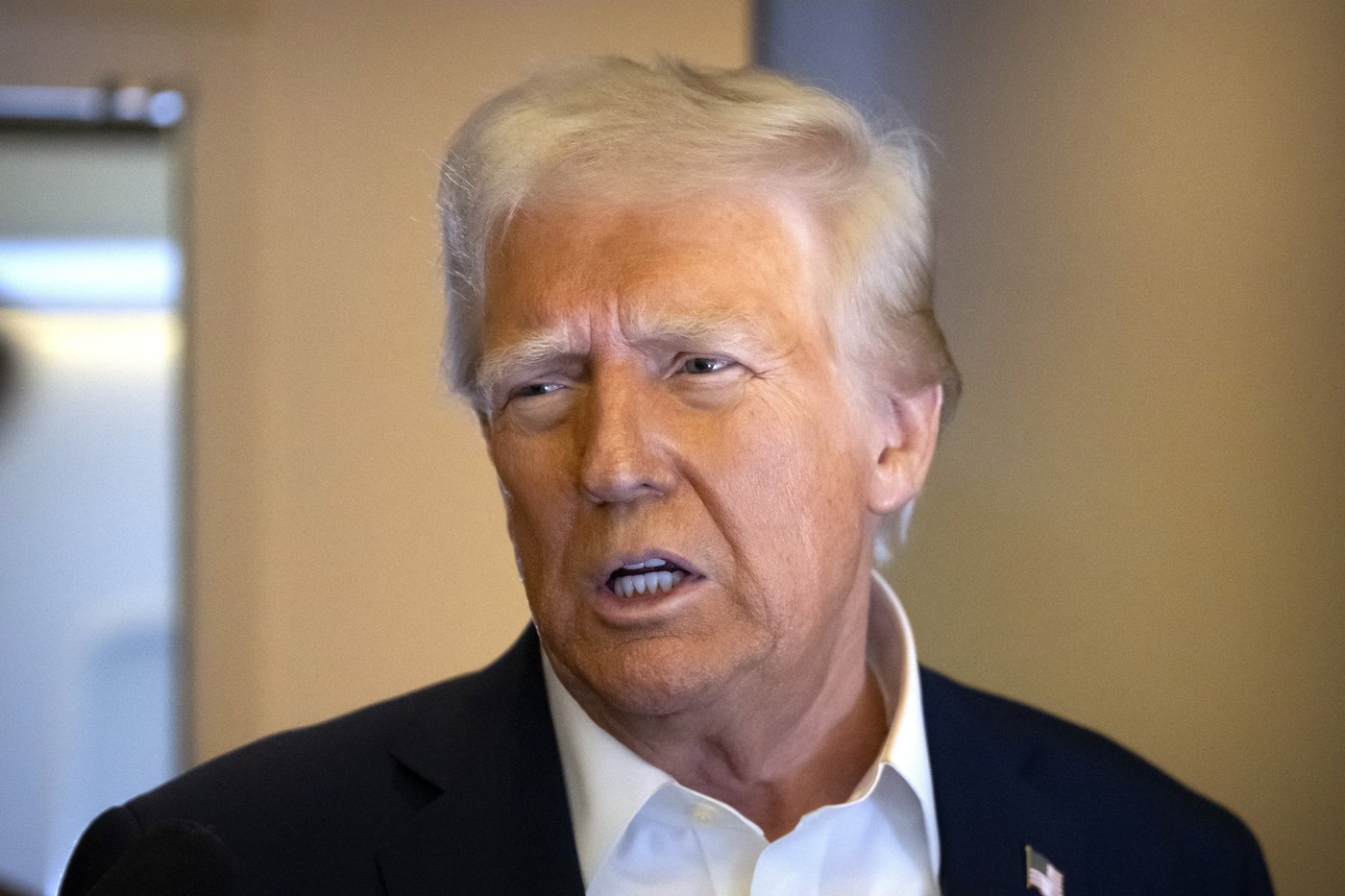 The Latest: Justice Department fires over a dozen employees who helped prosecute Trump | iNFOnews.ca