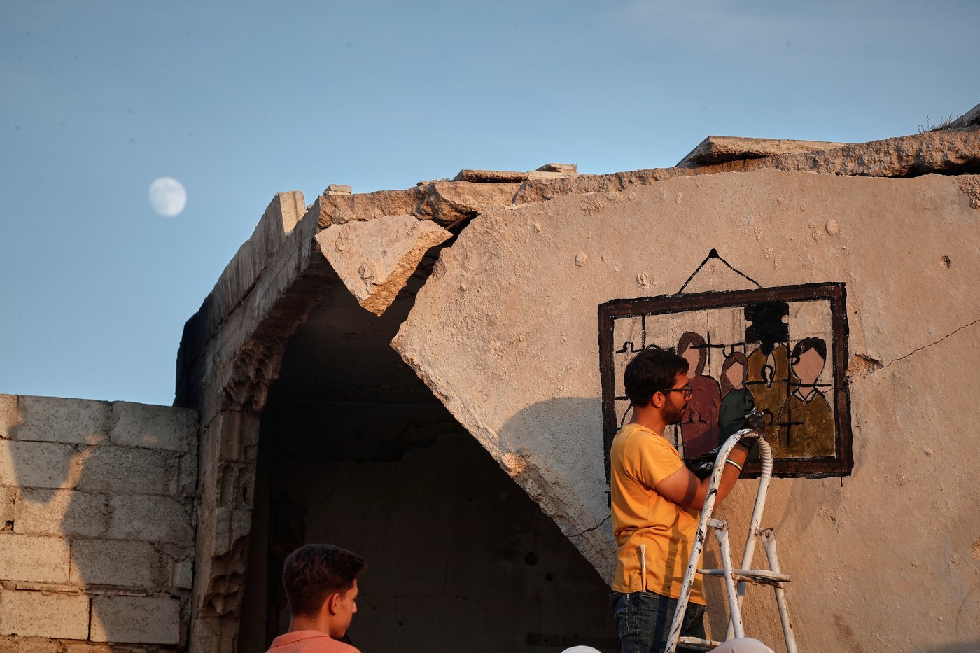 Syrian artists transform bombed-out house into a mural of remembrance, in photos | iNFOnews.ca