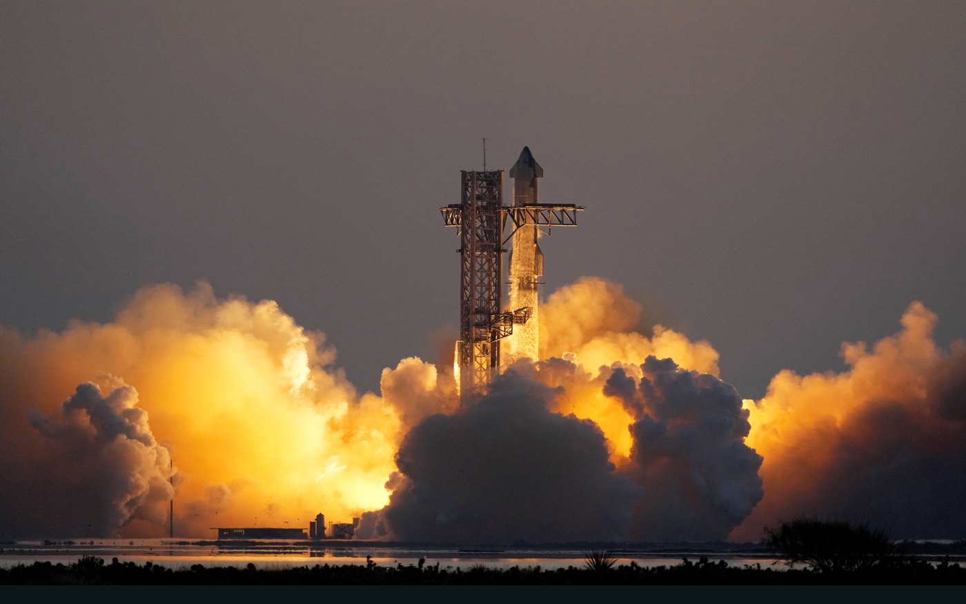 In an engineering feat, mechanical SpaceX arms catch Starship rocket booster back at the launch pad | iNFOnews.ca