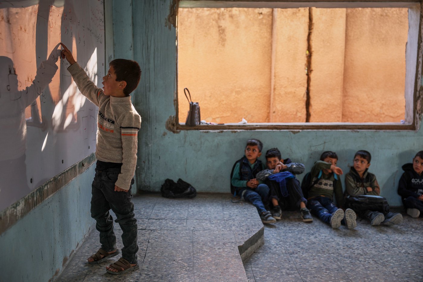 Photos show Syrian students returning to schools stripped bare by conflict | iNFOnews.ca