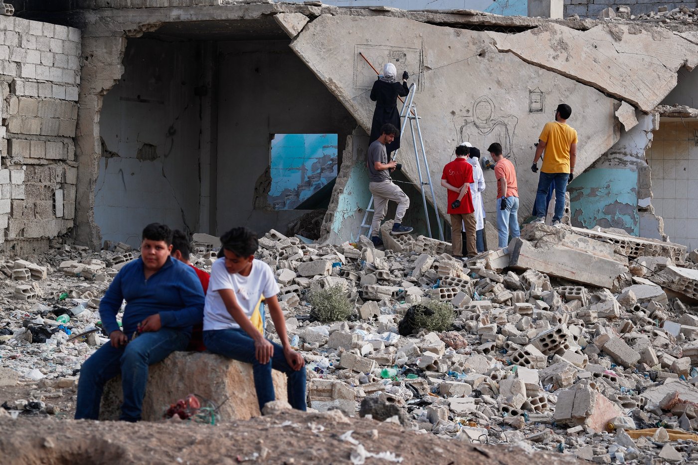 Syrian artists transform bombed-out house into a mural of remembrance, in photos | iNFOnews.ca