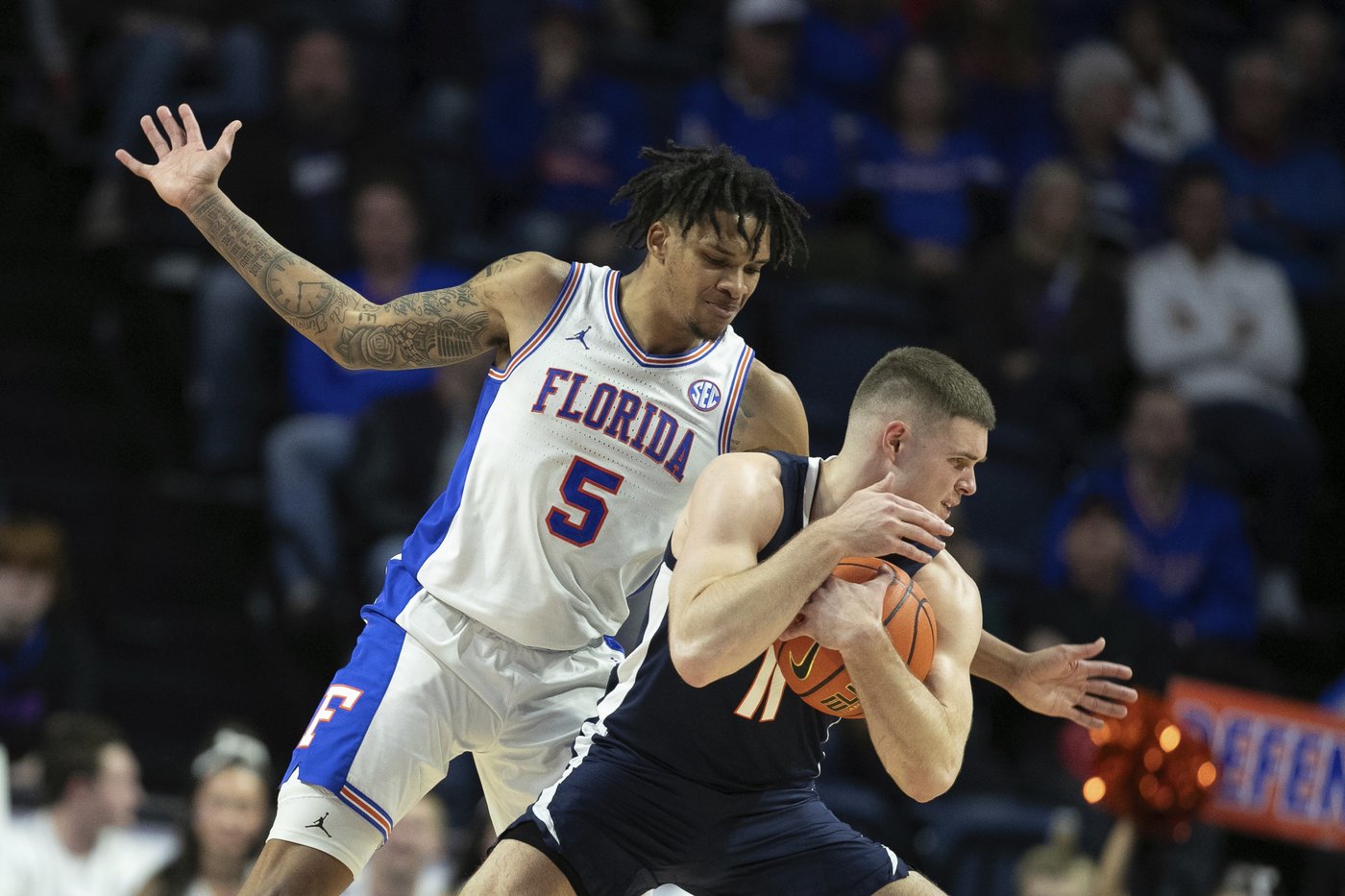 Walter Clayton scores 27 points, No. 13 Florida beats Virginia 87-69 in SEC/ACC Challenge | iNFOnews.ca Walter Clayton scores 27 points, No. 13 Florida beats Virginia 87-69 in SEC/ACC Challenge | iNFOnews.ca