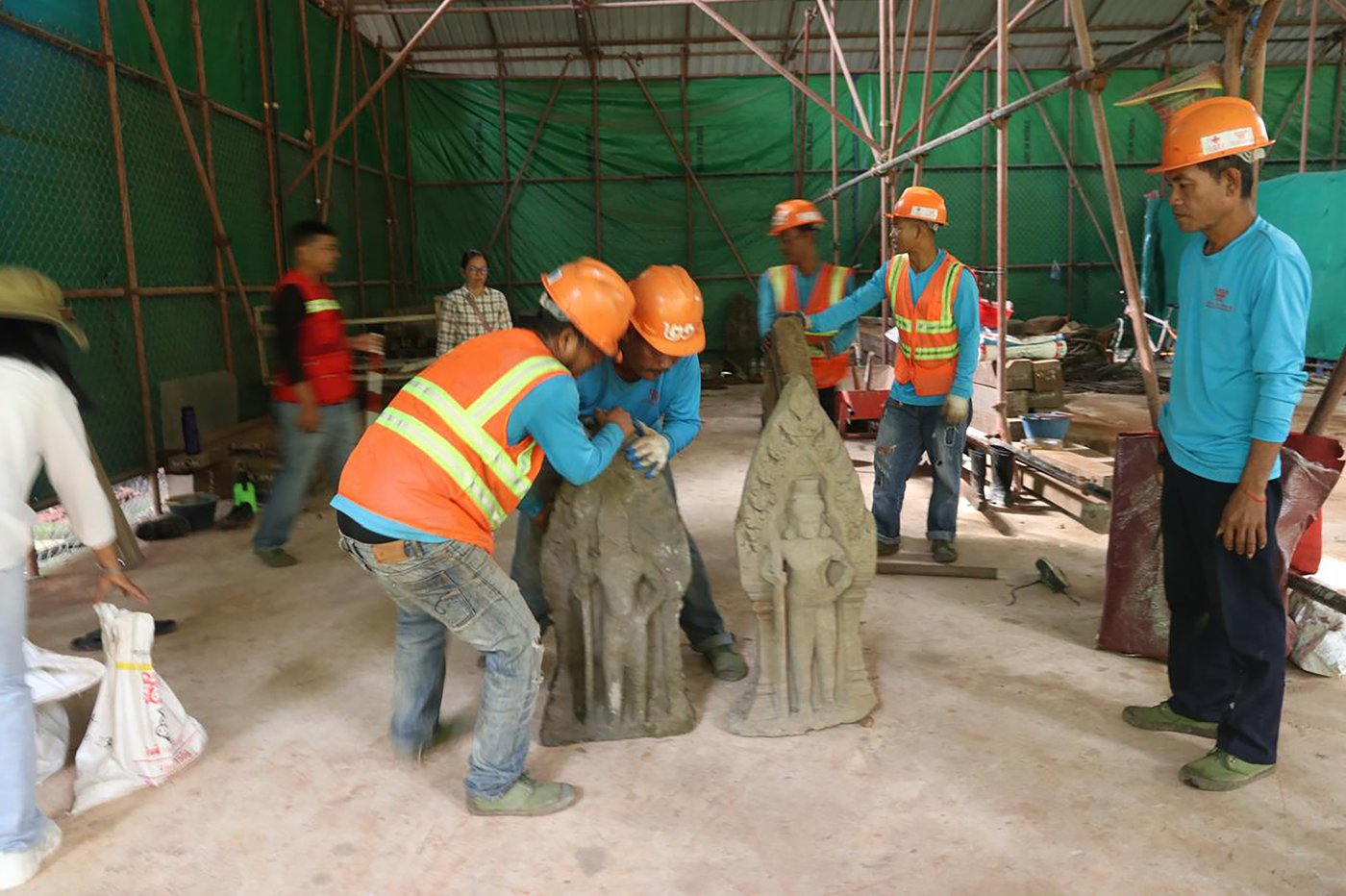 Cambodian archaeologists discover a dozen centuries-old sandstone statues at Angkor UNESCO site | iNFOnews.ca Cambodian archaeologists discover a dozen centuries-old sandstone statues at Angkor UNESCO site | iNFOnews.ca