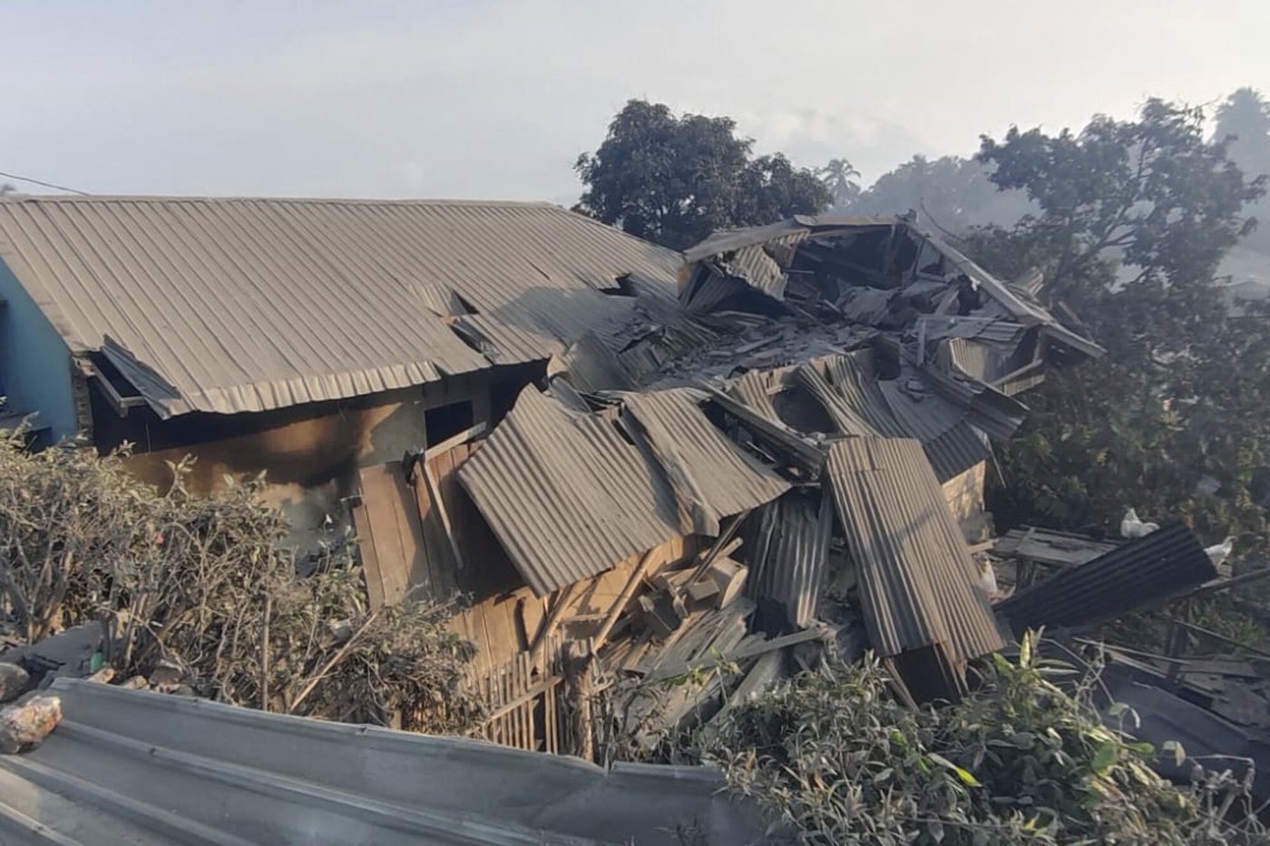 Indonesian rescuers dig through volcanic ash after eruption kills 9 and destroys buildings | iNFOnews.ca