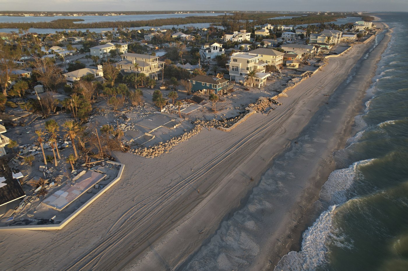 Florida digs out of mountains of sand swept in by back-to-back hurricanes | iNFOnews.ca