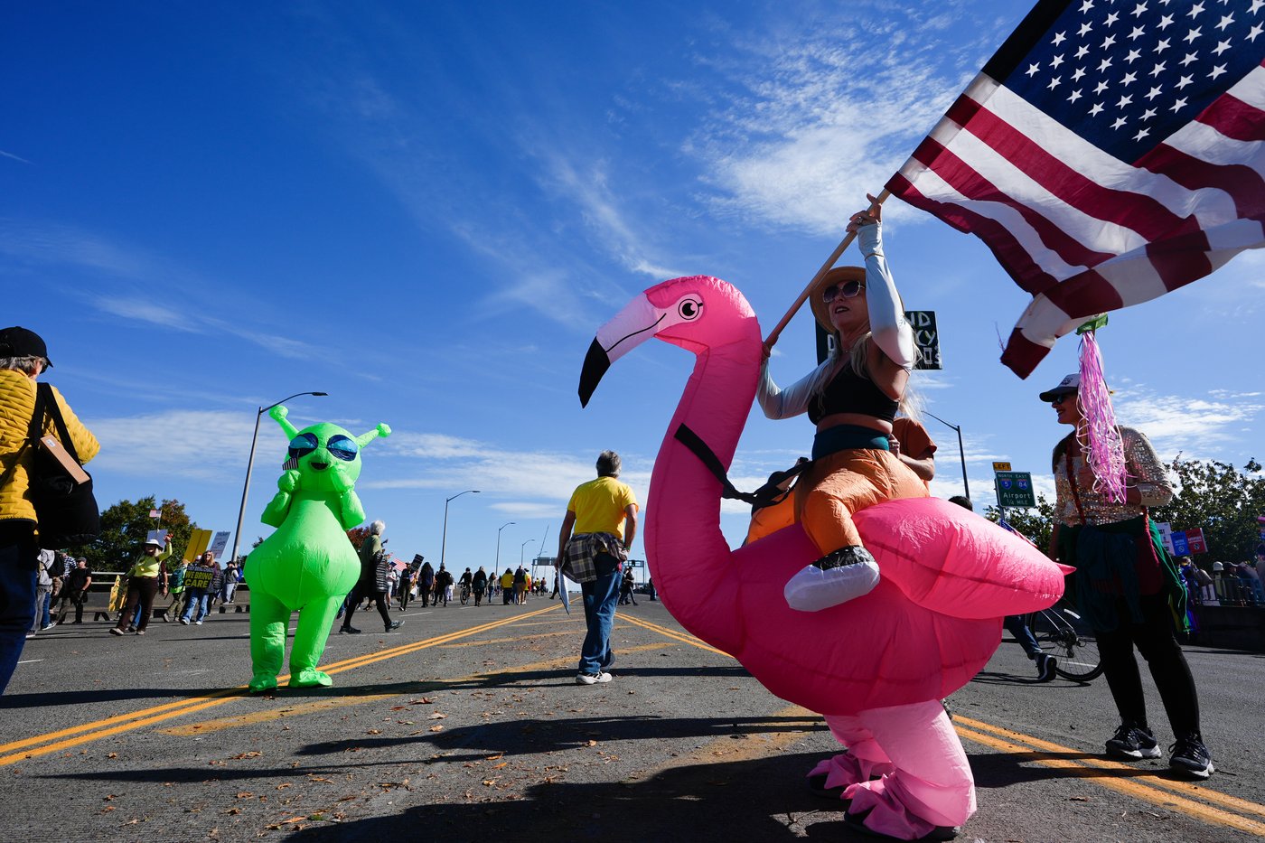 Inflatable costumes used to deflate tensions at rallies against Trump, in photos | iNFOnews.ca