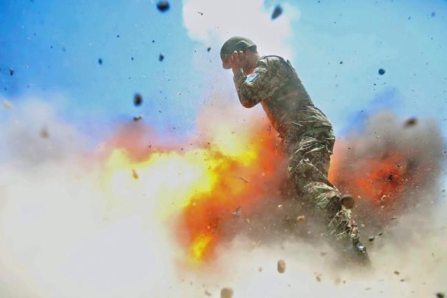 Army photographer captures her own death in mortar explosion | iNFOnews.ca