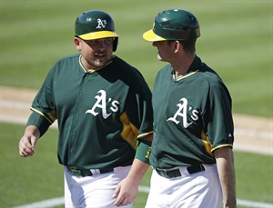 Michigan coach Jim Harbaugh joins staff of Oakland A's for day at spring training in Arizona | iNFOnews.ca CP32190072