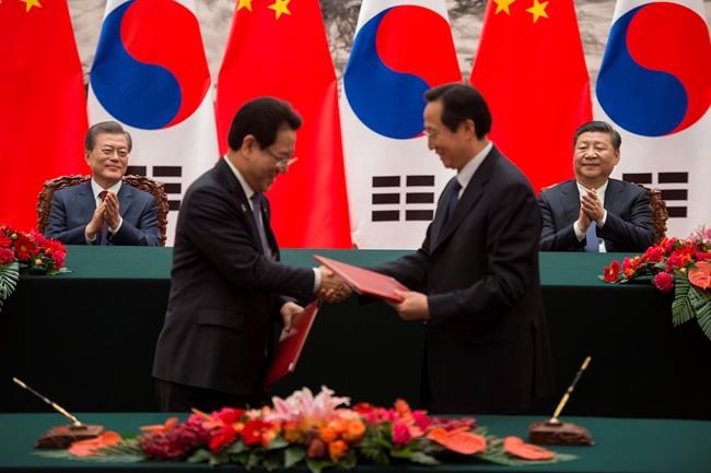 South Korean President Moon in China on visit to repair ties | iNFOnews.ca