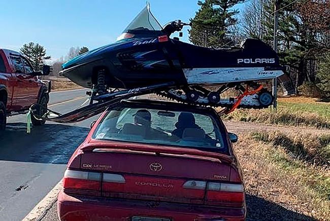 Wisconsin trooper stops driver hauling snowmobile atop car | iNFOnews.ca
