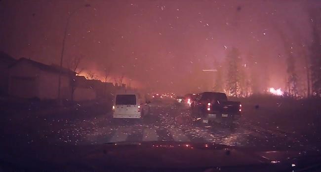 Dash cam video shows terrifying drive out of fiery Fort McMurray for evacuees | iNFOnews.ca