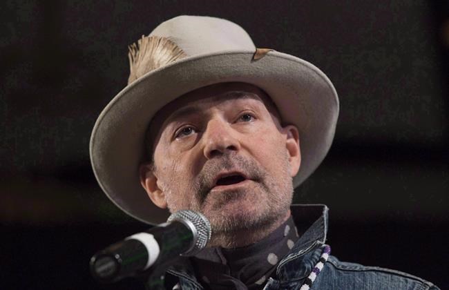Fake Tragically Hip merchandise still duping fans, warns guitarist Rob Baker | iNFOnews.ca