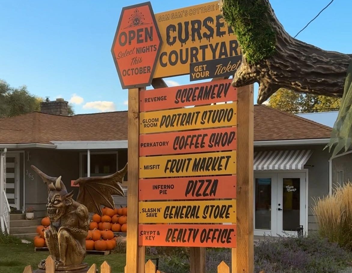'We don’t have coffee': South Okanagan Halloween display causes confusion | iNFOnews.ca A decorative orange wooden sign displays a list of shops at a Halloween display.