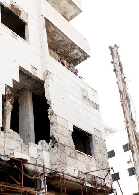 The Latest: Syrian Kurdish-led forces shelled by Turkey | iNFOnews.ca