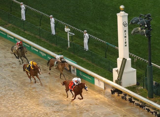 Justify wins sloppy Kentucky Derby, Baffert takes 5th title | iNFOnews.ca