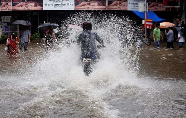 Image of Asia: Driving through the rain in Mumbai | iNFOnews.ca CP301707727