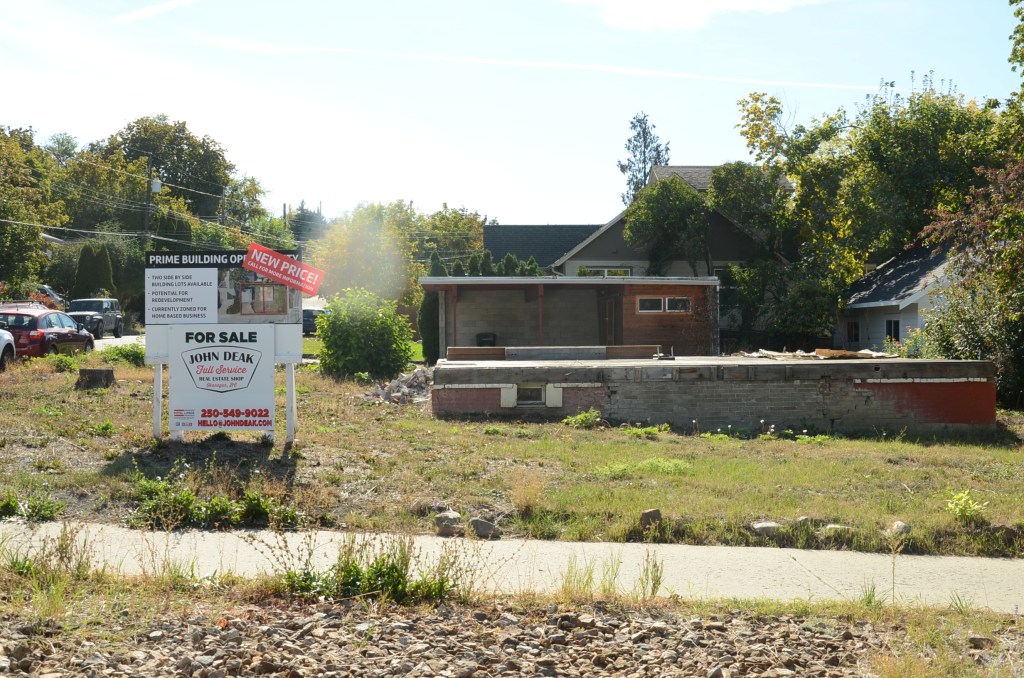 'Super efficient' but slow uptake on streamlined housing development in Okanagan, Kamloops | iNFOnews.ca a demolished house with a for sale sign