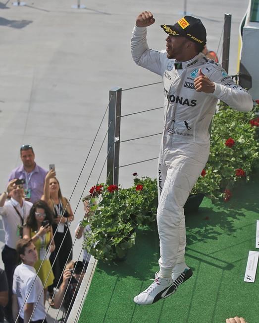 Hamilton wins Hungarian GP to take overall lead from Rosberg | iNFOnews.ca