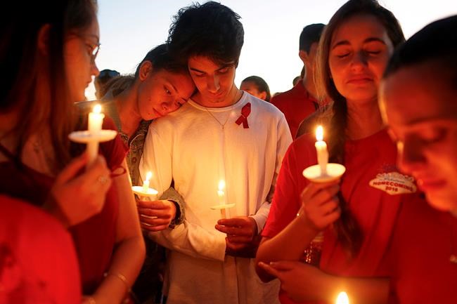 The Latest: Hundreds at vigil mourn school shooting victims | iNFOnews.ca