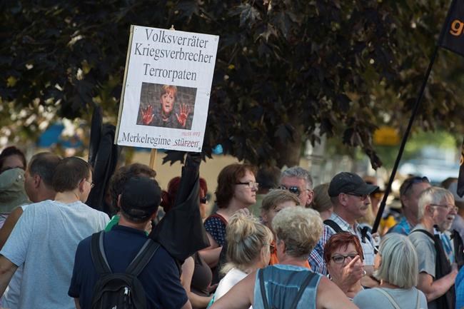 Protester who harassed German reporters works for police | iNFOnews.ca