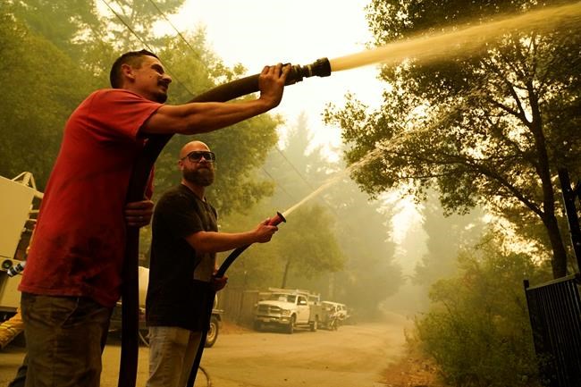 Neighbors with hoses target fires as crews urge them to stop | iNFOnews.ca
