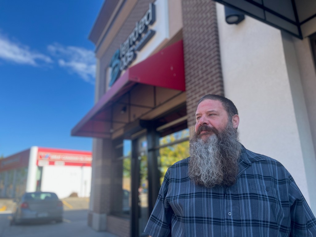 Cannabis store owner kevin demers stands outside his vernon cannabis store.