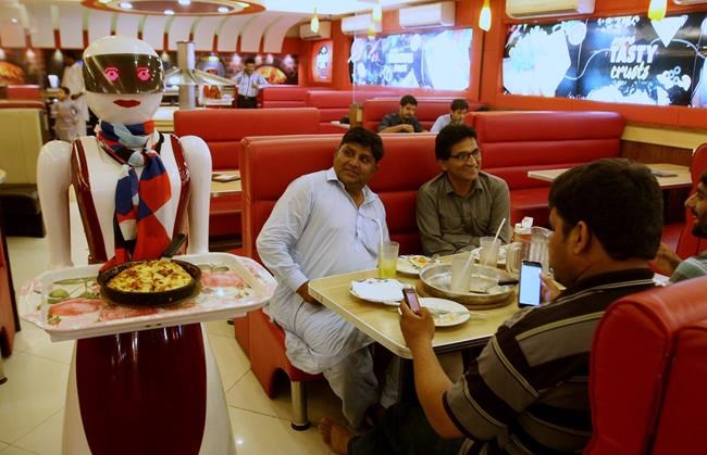 'Robot waitress' draws customers to Pakistani pizza joint | iNFOnews.ca
