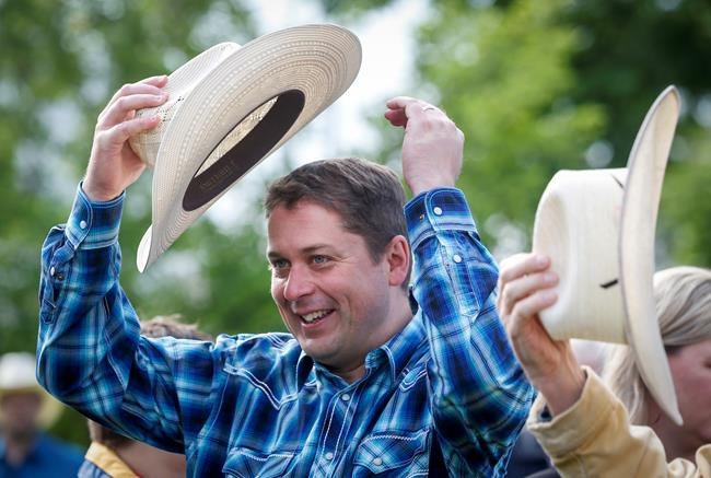 Scheer flips pancakes, appeals for votes on Calgary Stampede circuit | iNFOnews.ca