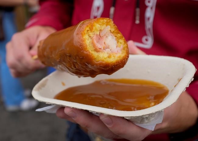 Deep-fried Coke gives way to poutine corn dog on the Calgary Stampede menu | iNFOnews.ca Deep-fried Coke gives way to poutine corn dog on the Calgary Stampede menu | iNFOnews.ca