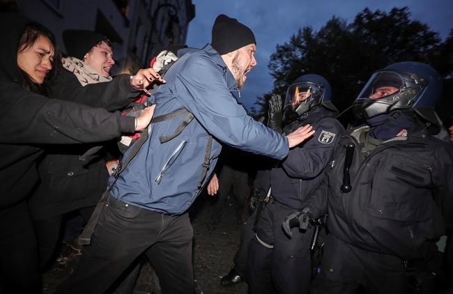 The Latest: Berlin officers hit with bottles, flag poles | iNFOnews.ca