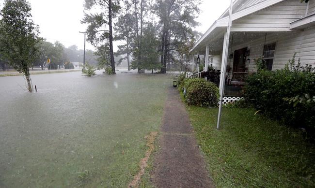 The Latest: Floodwaters rise in southwest Louisiana homes | iNFOnews.ca