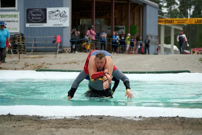 Lithuanian couple crowned 'wife carrying' world champions | iNFOnews.ca