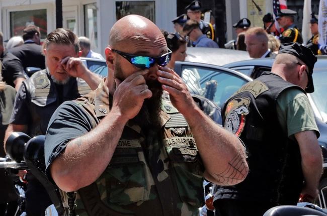 The Latest: Biker killed remembered as public servant | iNFOnews.ca