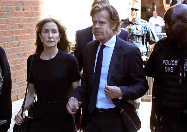 The Latest: Huffman gets 14 days behind bars in college scam | iNFOnews.ca The Latest: Huffman gets 14 days behind bars in college scam | iNFOnews.ca