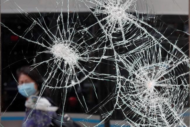 Brooms in hand, people patch up stores damaged in protests | iNFOnews.ca