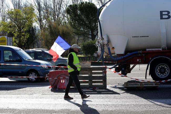 The Latest: Macron visits building torched by protesters | iNFOnews.ca