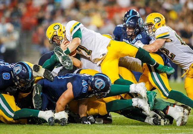 Harris throws three TD passes, runs for two others as Eskimos down Argos | iNFOnews.ca