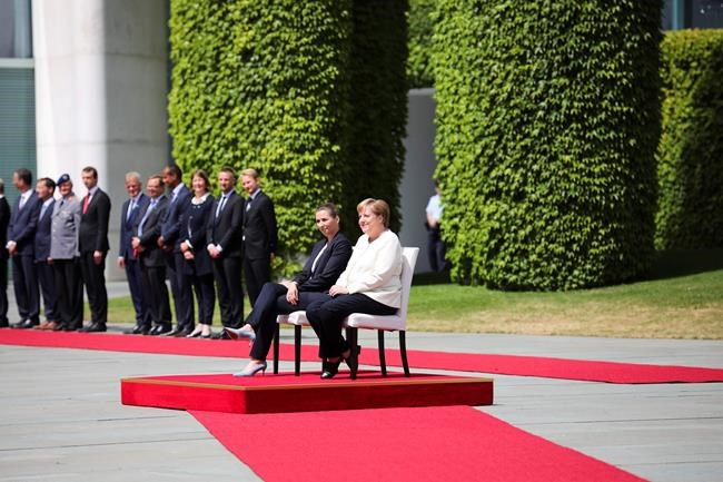 Germany's Merkel sits for anthems after shaking episodes | iNFOnews.ca Germany's Merkel sits for anthems after shaking episodes | iNFOnews.ca