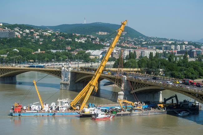 The Latest: Crane lifts sunken tour boat out of Danube River | iNFOnews.ca The Latest: Crane lifts sunken tour boat out of Danube River | iNFOnews.ca