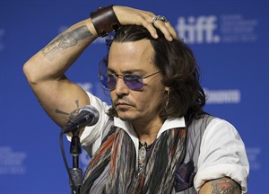 Johnny Depp adds tattoos with Damien Echols after helping secure his prison release | iNFOnews.ca CP20055111