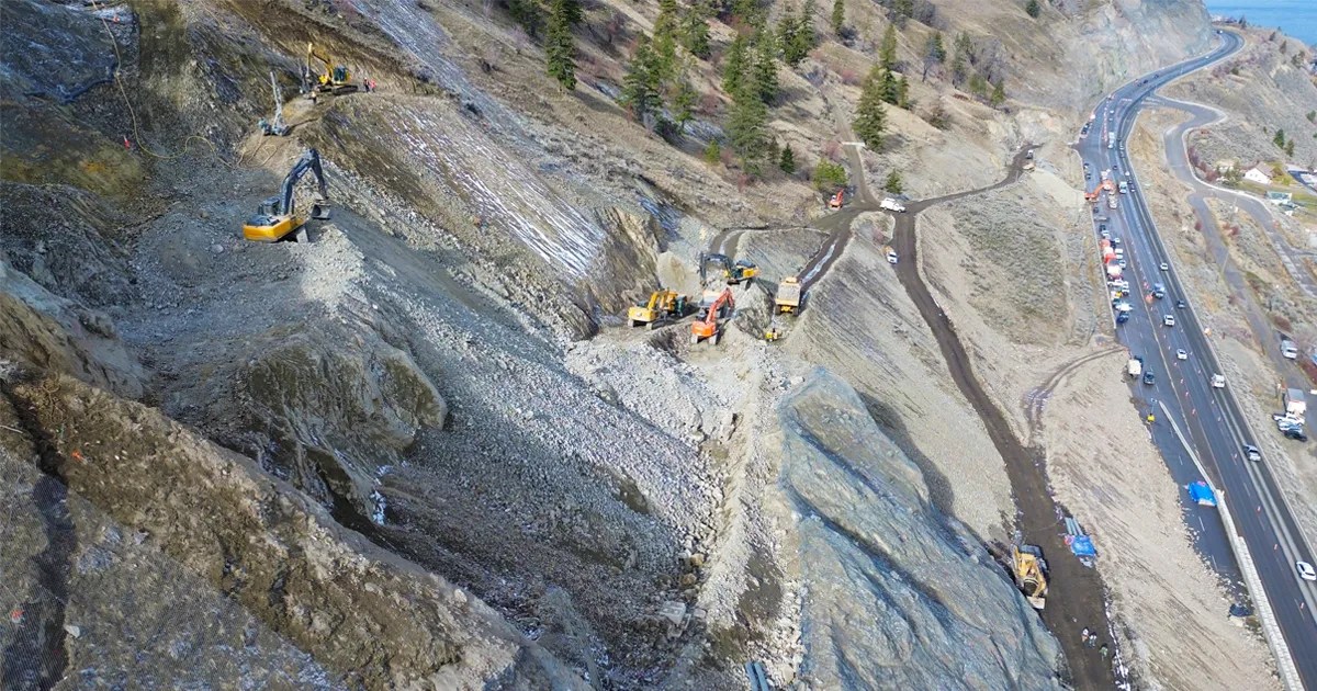 Heavy machinery on the slope of the Summerland rockslide site along Highway 97.