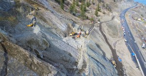 Heavy machinery on the slope of the Summerland rockslide site along Highway 97.