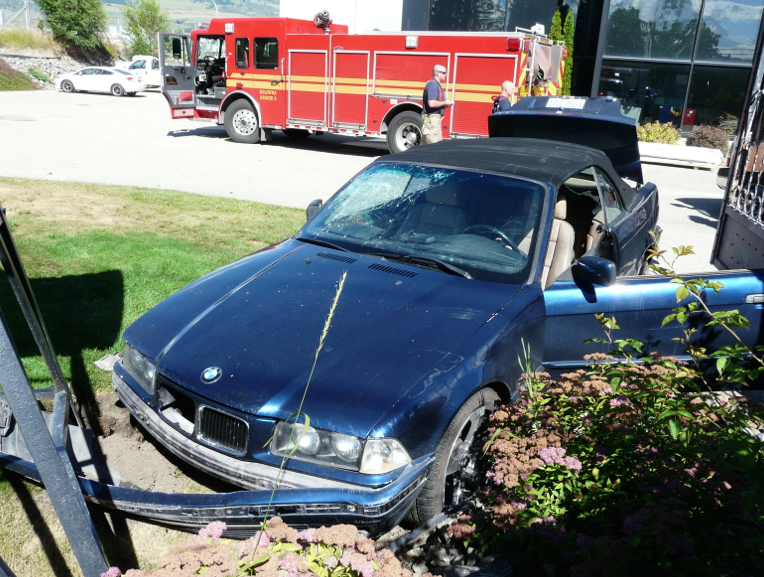Man injured after driving car over embankment into yard at a north end business | iNFOnews.ca
