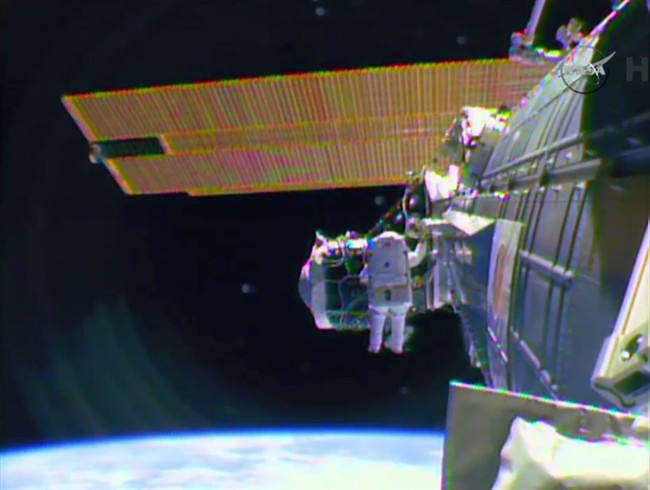 Spacewalking astronauts finish extensive, tricky cable job, routing 764 feet outside station | iNFOnews.ca