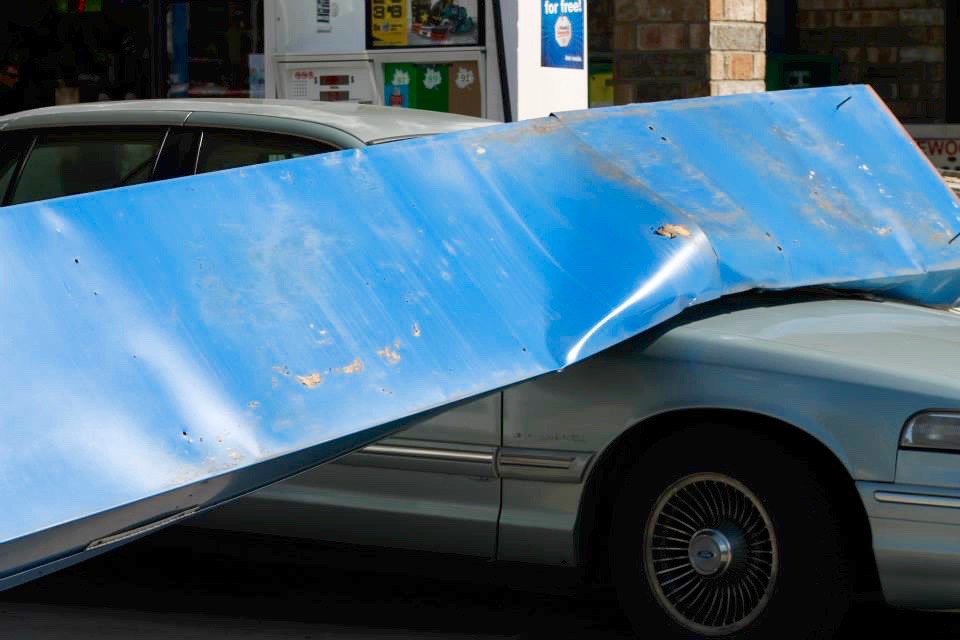 Falling signage slams car at Penticton gas station | iNFOnews.ca